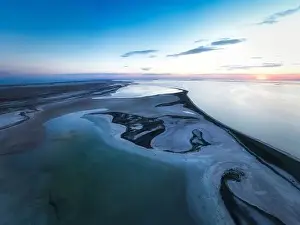 Unusual islands on a brilliant lake, top view, drone camera