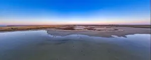 Unusual islands on a brilliant lake, top view, drone camera