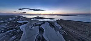 Unusual islands on a brilliant lake, top view, drone camera