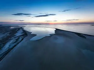 Unusual islands on a brilliant lake, top view, drone camera
