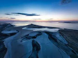Unusual islands on a brilliant lake, top view, drone camera