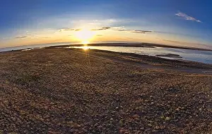 Sky Clouds Prints: Unusual islands on a brilliant lake, top view, drone camera
