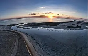 Sky Clouds Prints: Unusual islands on a brilliant lake, top view, drone camera