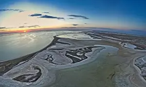 Sky Clouds Prints: Unusual islands on a brilliant lake, top view, drone camera