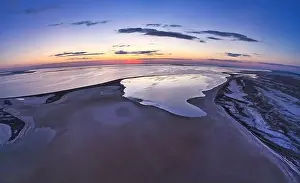 Sky Clouds Prints: Unusual islands on a brilliant lake, top view, drone camera