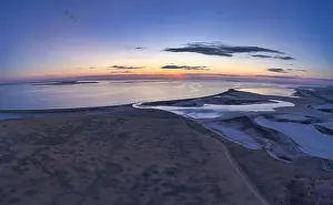 Sky Clouds Prints: Unusual islands on a brilliant lake, top view, drone camera