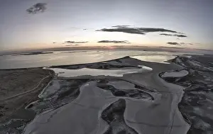 Sky Clouds Prints: Unusual islands on a brilliant lake, top view, drone camera