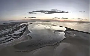 Sky Clouds Prints: Unusual islands on a brilliant lake, top view, drone camera
