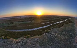 Sky Clouds Prints: Unusual islands on a brilliant lake, top view, drone camera