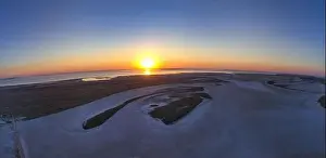 Sky Clouds Prints: Unusual islands on a brilliant lake, top view, drone camera
