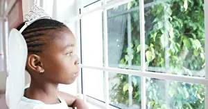 Dreaming Prints: Upset girl in fairy costume looking through window at home 4k