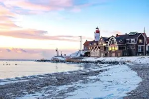 Landscape House Prints: Urk Netherlands lighthouse during winter with snow covered coastline