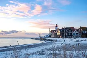 Landscape House Prints: Urk Netherlands lighthouse during winter with snow covered coastline