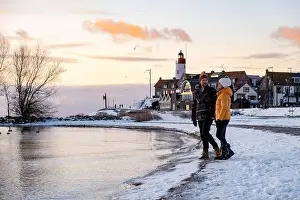 Ijsselmeer Prints: Urk Netherlands lighthouse during winter with snow covered coastline