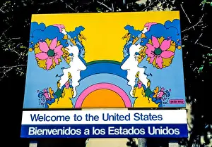 Welcoming Prints: A U.S. government sign illustrated by American artist Peter Max welcomes visitors