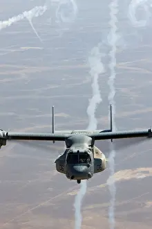Marine Corps Prints: A U.S. Marine Corps MV-22 Osprey expends flares during a combat operation over the Helmand Province of southern