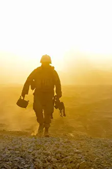 Outpost Prints: U.S. Navy Construction Mechanic 3rd Class Ty Ramsey finishes a day of work at Combat Outpost Khavajeh Molk