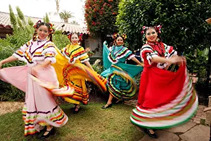 Skilled Prints: USA, California, San Diego, several members of Grupo Folklorico colorfully dance at the Fiesta de Reyes in Old Town