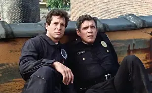 Film Still Prints: USA. G.W. Bailey and Steve Guttenberg in a scene the (C)Warner Bros