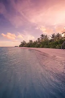 Vacation sunset at the beach. Palm trees sunset background. Waves, twilight sky clouds. Amazing island palms beach background, nature sunset landscape