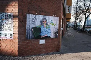 Brick Wall Prints: Vandalized photograph on a wall in Berlin's Neukölln neighborhood