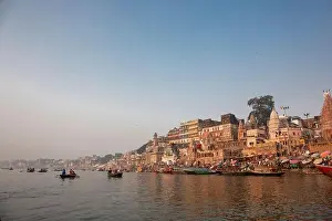 Water Tourism Prints: Varanasi India ancient city architecture panoramic view at sunset as seen from a boat on river Ganges