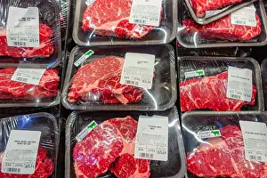 Grocery Store Prints: Various cuts of meat or beef on display in grocery store-supermarket refrigerator case