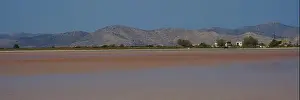 Salt Lake Prints: Vast landscape with mountains and huts by the lake
