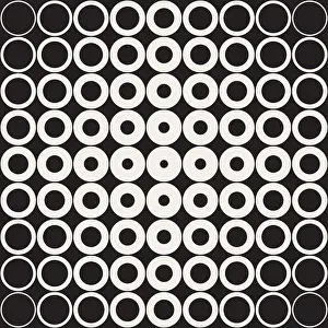 Vector Seamless Black and White Grid of Circles with Fading Outlines Towards The Corners Retro Pattern