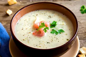 Celery Prints: Vegetable spicy cream soup with shrimps in bowl close up