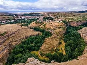 Vegetation at the foot of the hills that house the medieval village of Sepulveda in Spain
