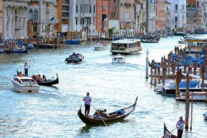 Venice, Italy - August 7, 2014: gondolas and boats on venetian Grand Canal