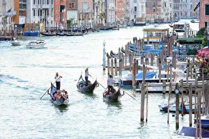 Venice, Italy - August 7, 2014: gondolas and boats on venetian Grand Canal