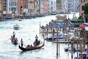 Venice, Italy - August 7, 2014: gondolas and boats on venetian Grand Canal
