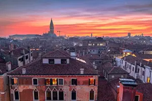 Venice, Italy rooftop skyline and historic landmarks at dusk