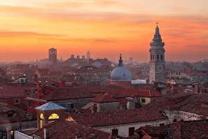 Venice, Italy rooftop skyline and historic landmarks at dusk