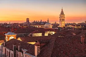 Venice, Italy rooftop skyline and historic landmarks at dusk