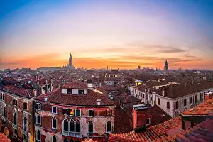 Venice, Italy rooftop skyline and historic landmarks at dusk