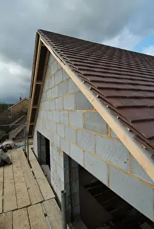 Roofing Prints: Verge detail and undercloak above barge board on concrete plain tiled roof to gable end of new detached house