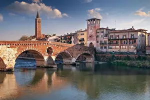 Verona, Italy. Cityscape image of beautiful Italian town Verona with the Stone Bridge over Adige River at sunset