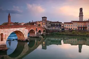 Verona, Italy. Cityscape image of beautiful Italian town Verona with the Stone Bridge over Adige River at sunset