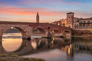 Riverfront Prints: Verona, Italy Town Skyline on the Adige River with Ponte Pietra at twilight