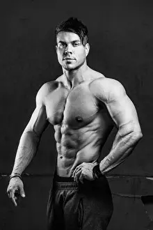 Bodybuilder Prints: Vertical grayscale portrait of a fit male bodybuilder posing