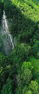 Schwyz Prints: Vertical panorama. Waterfall in the mountains near the village of Brunnen