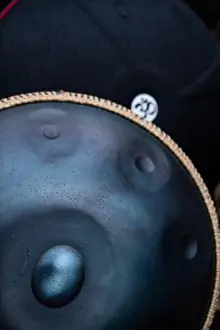 Shallow Focus Prints: A vertical shot of a handpan drum instrument