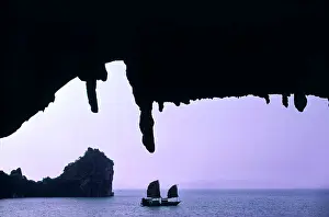 Islet Prints: Vietnam, Halong Bay classified World Heritage by UNESCO, view from a natural cave, a junk