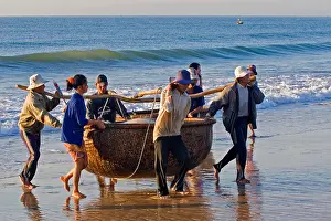 Occupations Prints: Vietnamese fishermen bringing in their basket boat