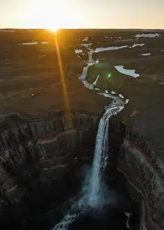 Basaltic Prints: View from above, stunning aerial view of the Hengifoss Waterfall