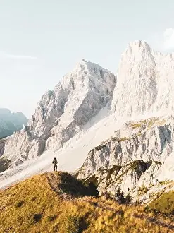 View from above, stunning aerial view of a person enjoying the view of Monte Pelmo from the summit of Col de la Puina