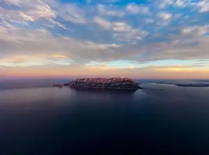 View from above, stunning aerial view of Tavolara Island during a dramatic sunset